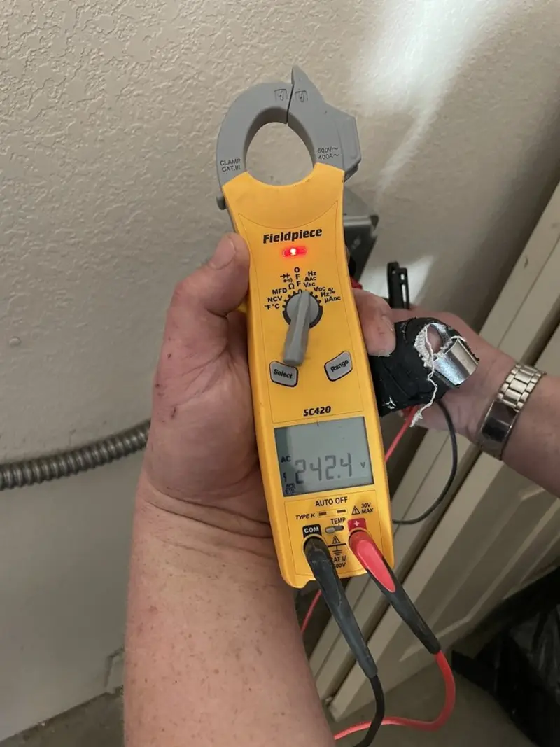 Voltage testing with clamp meter during Generator Installation in Marquette